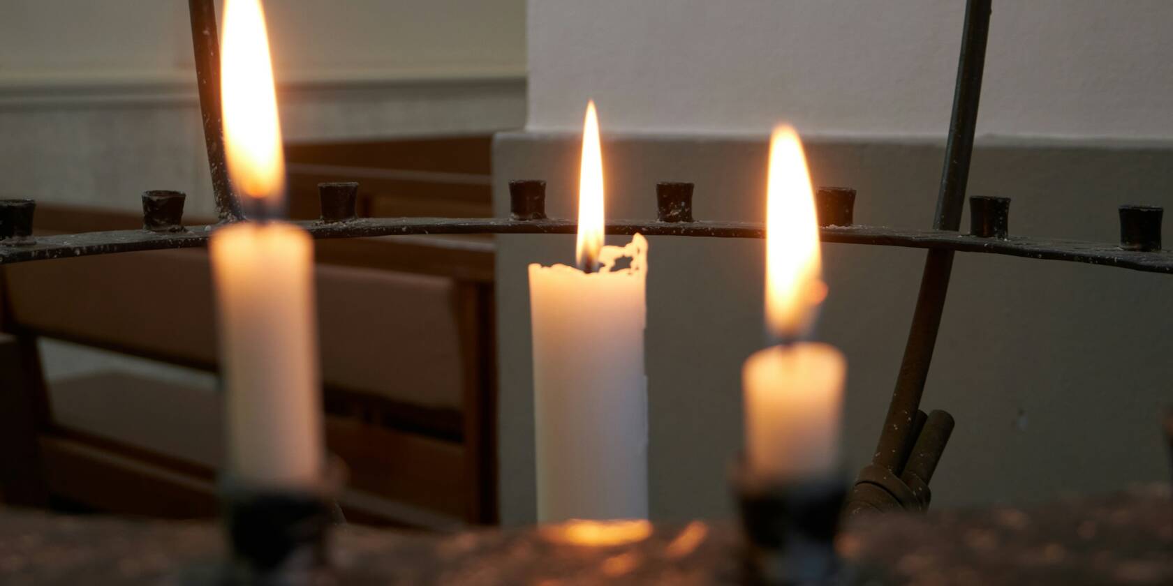 Three lighted candles